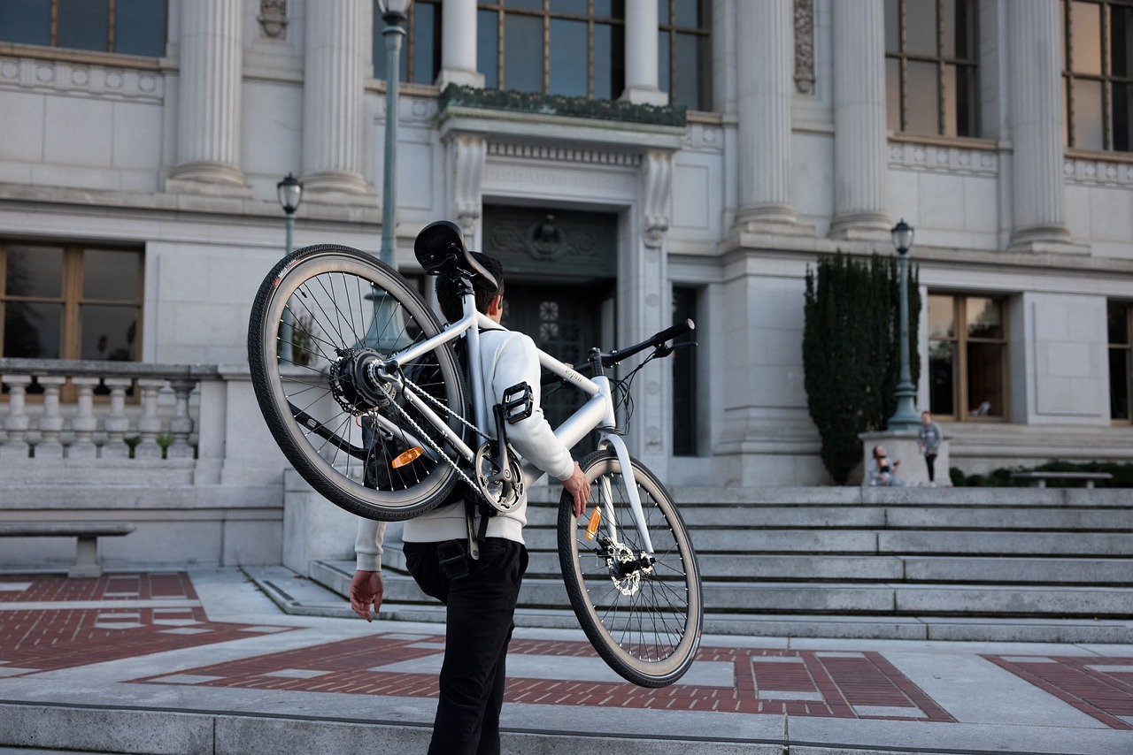 Man carrying electric bike