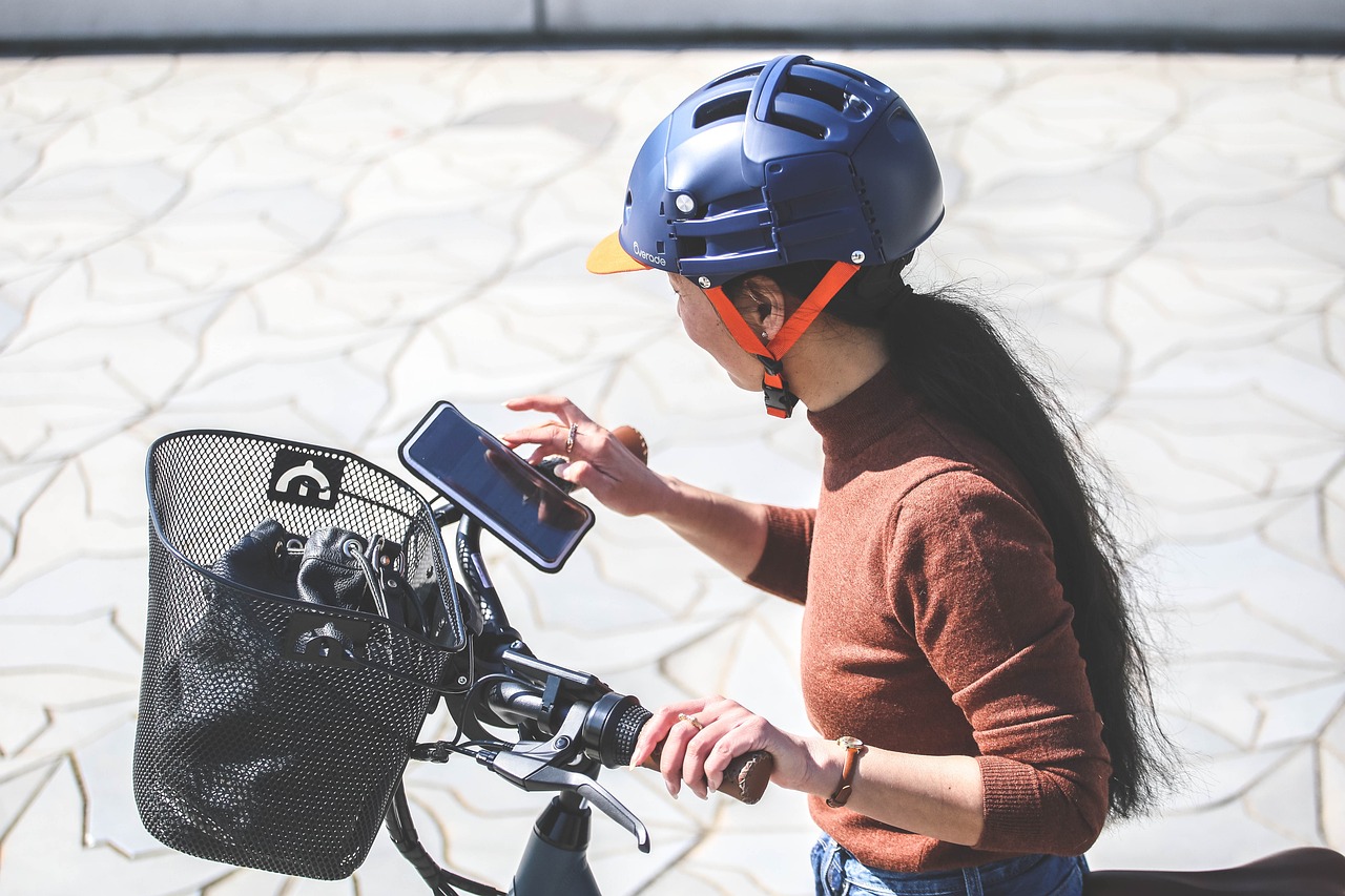 Woman uses phone attached to bike